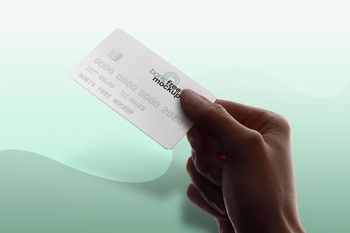 Free PSD hand holding credit card mockup rendition image