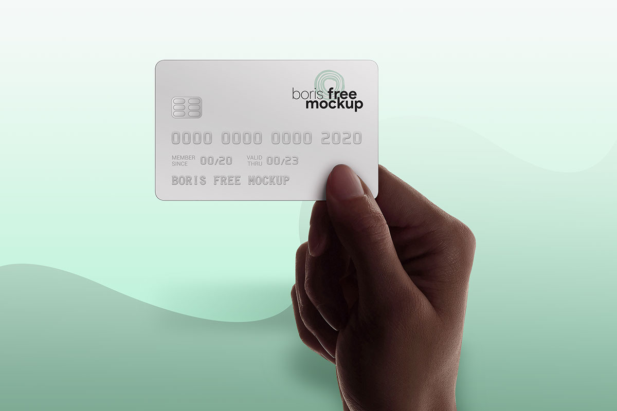Free PSD hand holding credit card mockup rendition image