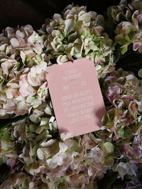 Card between flowers